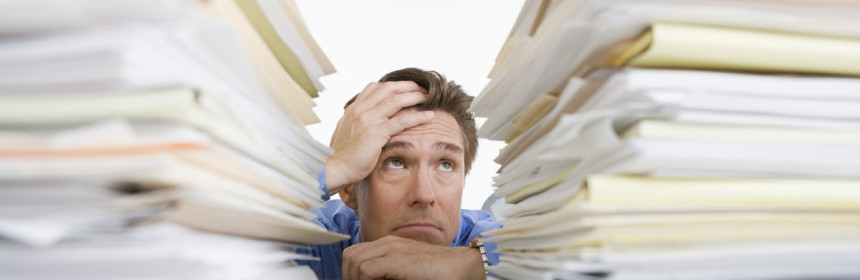 man overwhelmed by paper - state exclusion list